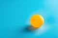 A dent pingpong ball on blue Royalty Free Stock Photo