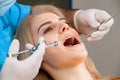 Dental anesthesia, beautiful young woman getting injection before treatment