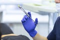 dental anesthesia syringe in hand of dentist. doctor doing anesthesia to patient. Royalty Free Stock Photo
