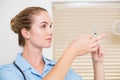 Dental assistant preparing an injection Royalty Free Stock Photo