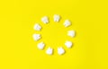 Dental background. Teeth models making round on a yellow background. Royalty Free Stock Photo