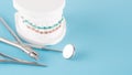 Dental braces model with mouth mirror in dental care concept. Royalty Free Stock Photo