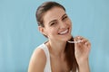 Dental care. Smiling woman using removable clear teeth braces Royalty Free Stock Photo