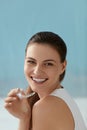 Dental care. Smiling woman with white smile using whitening tray