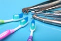 Dental care toothbrush with dentist tools on mirror background. Selective focus. Royalty Free Stock Photo