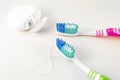 Dental care. Toothbrushes and dental floss on white background. Close up
