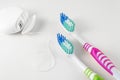 Dental care. Toothbrushes and dental floss on white background. Close up