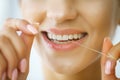 Dental Care. Woman With Beautiful Smile Using Floss For Teeth. H