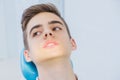 Dental caries prevention.Teenage boy at the dentist`s chair during a dental procedure, smile close up. Healthy Smile. Royalty Free Stock Photo