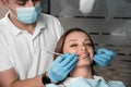 In the dental chair, the patient feels comfortable and reliable when the doctor uses the tools for high-quality Royalty Free Stock Photo