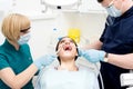 Dental cleaning, woman under treatment.