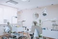 Dental clinic interior design with several dentists chair and tools. Modern dental clinic office with green chairs. Dental office Royalty Free Stock Photo