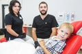 Dental clinic. Reception, examination of the patient. Teeth care. Dentist treating teeth of little boy in dentist office Royalty Free Stock Photo