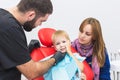 Dental clinic. Reception, examination of the patient. Teeth care. Dentist treating teeth of little boy in dentist office Royalty Free Stock Photo