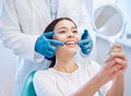 Dental consultation, mirror and woman with smile after teeth whitening, service or mouth care. Healthcare, dentistry and Royalty Free Stock Photo
