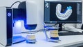 Dental 3D Printer and Digital Model on Computer Screen in Modern Clinic Royalty Free Stock Photo