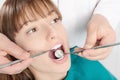 Dental examination of nice cheerful girl