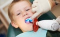 Dental filing of child tooth by