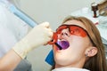 Dental filing of child tooth by ultraviolet light Royalty Free Stock Photo