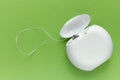 Dental floss on a green background with copy space, top view Royalty Free Stock Photo