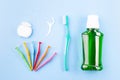 Dental floss, toothbrush, interdental brush angles and mouthwash on blue Royalty Free Stock Photo