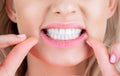 Dental flush - woman flossing teeth. Dental floss. Taking care of teeth. Healthy teeth concept. Teeths Flossing. Oral