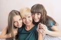 Dental Health and Hygiene Concepts: Three Young Ladies with Teeth Braces Together In Home Environment Smiling and Embracing