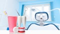 Dental health and teethcare concept. Dental mirror and explorer instrument in white tooth model, human jaw and dental floss near Royalty Free Stock Photo