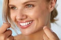 Dental Health. Woman With Beautiful Smile Flossing Healthy Teeth Royalty Free Stock Photo