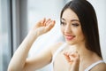 Dental Health. Woman With Beautiful Smile Flossing Healthy Teeth Royalty Free Stock Photo