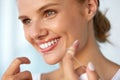 Dental Hygiene. Beautiful Woman Flossing Healthy White Teeth Royalty Free Stock Photo