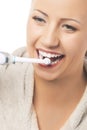 Dental Hygiene Concept:Caucasian Woman Cleaning Teeth With Modern Electric Toothbrush Royalty Free Stock Photo