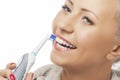 Dental Hygiene Concept:Caucasian Woman Face Closeup Brushing Her