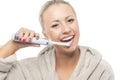 Dental Hygiene Concept:Happy smiling Blond Brushing Her Teeth Wi