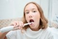 Dental hygiene. Happy little blonde girl brushing her teeth. Healthy concept Royalty Free Stock Photo