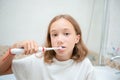 Dental hygiene. Happy little blonde girl brushing her teeth. Healthy concept Royalty Free Stock Photo