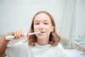 Dental hygiene. Happy little blonde girl brushing her teeth. Healthy concept Royalty Free Stock Photo