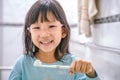 Dental hygiene. happy little girl brushing her teeth.Little girl brushing teeth in bath Royalty Free Stock Photo