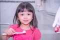 Dental hygiene. happy little girl brushing her teeth.Little girl brushing teeth in bath Royalty Free Stock Photo