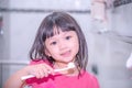 Dental hygiene. happy little girl brushing her teeth.Little girl brushing teeth in bath Royalty Free Stock Photo