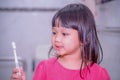 Dental hygiene. happy little girl brushing her teeth.Little girl brushing teeth in bath Royalty Free Stock Photo