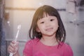 Dental hygiene. happy little girl brushing her teeth.Little girl brushing teeth in bath. Royalty Free Stock Photo