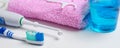 Dental hygiene. Toothbrush, mouthwash, pink towel, dental floss Royalty Free Stock Photo