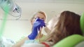 Dental hygienist check up patient teeth. Stomatology professional working