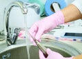 Dental instrument disinfection. Rinse a medical instrument under running water. Disinfection in a medical center, hospital, office Royalty Free Stock Photo