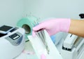 Dental instrument packaging in a sterilization bag.A medical worker puts a medical instrument in a device for disinfection and Royalty Free Stock Photo