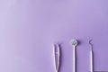 Dental instruments on colorful background with copy spac. Top view.