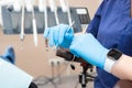 dental instruments in the hands of the doctor. Dentist in sterile latex gloves holding dental tools Close-up Royalty Free Stock Photo