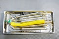 dental instruments in a medical container on the table,