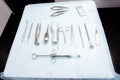 Dental instruments on a sterile table before surgery